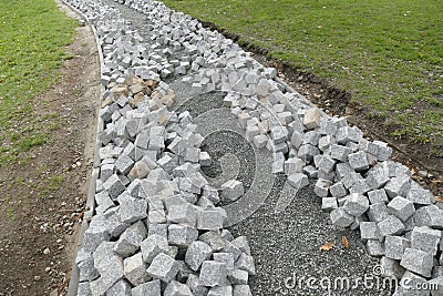 Reconstruction of a pack sidewalk with cobbles Stock Photo