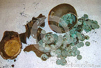 Reconstruction of a placer of silver coins of the 17th century and a jug in the form of a treasure Stock Photo