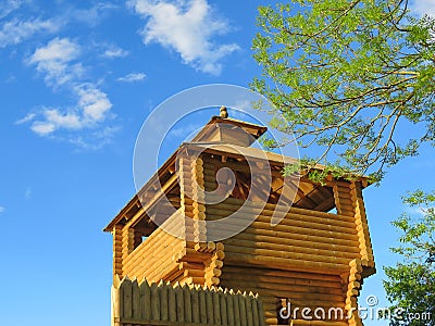 Reconstruction of a wooden fortification on the background blue sky Stock Photo