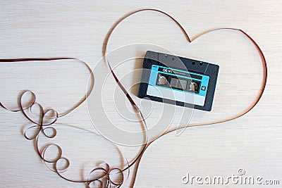 The recorder cartridge from the 90th lies in heart from a magnetic tape Stock Photo