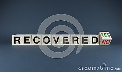 Recovered no or Recovered yes. The dice form the selection words Recovered no or yes Stock Photo