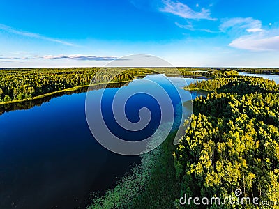 Recreation near blue lakes in open air. Forest around water reservoir, aerial landscape Stock Photo