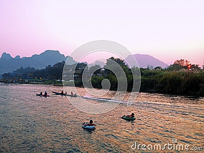 Recreation.Tourist kakaking and tubing along the river Stock Photo