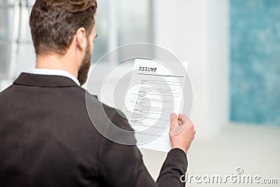 Recruiter with resume paper Stock Photo