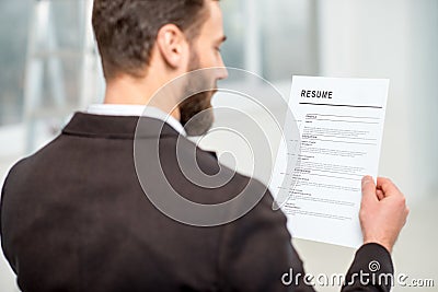 Recruiter with resume paper Stock Photo