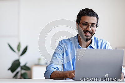 Recruitment Concept. Smiling Western Guy Using Laptop, Searching Jobs Online In Internet Stock Photo