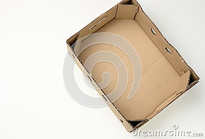 Rectangular empty cardboard box of brown paper on a white background, box without a lid for vegetables and fruits in with holes Stock Photo