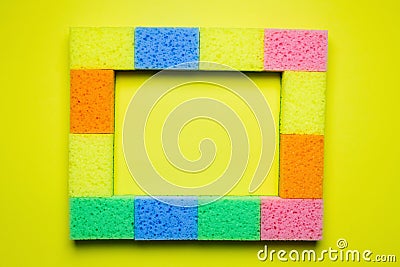 rectangular frame of multicolored sponges on Stock Photo