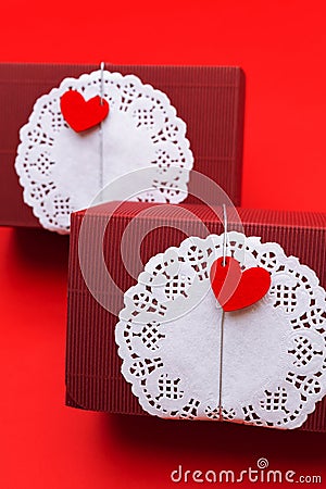 Rectangular gift box with circular white paper towel and red heart shape. Vertical shot Stock Photo
