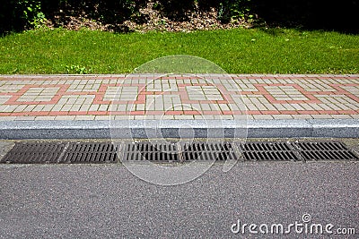 Rectangular hatches of the lattice of the drain system for drainage. Stock Photo