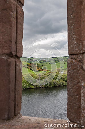 Rectangular slit in the wall of the ruins of Urquhart Castle, Loch Ness Stock Photo