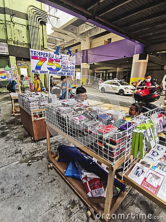 Recto, Manila, Philippines - Sidewalk stalls selling cellphone cases and tempered glass outside Editorial Stock Photo