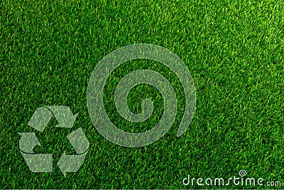Recyclable Symbol a green grass background Stock Photo
