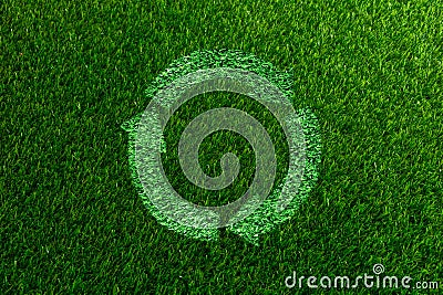 Recyclable Symbol a Green grass White background Stock Photo
