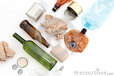 Recyclable waste, resources. Clean glass, paper, plastic and metal on white background. Copyspace for text. Recycling, reuse, garb Stock Photo