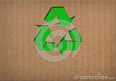 Recycle symbol on cardboard texture Stock Photo