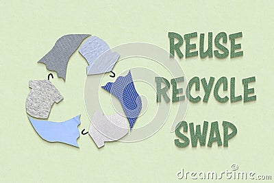 Recycle textiles symbol made from old clothing fabric on green background Stock Photo