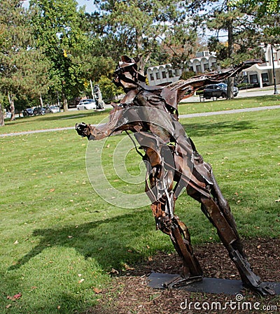 recycled metal art sculpture of a skater, boy, girl Editorial Stock Photo