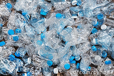 Recycling concept. problem of ecology, environmental pollution. Background of plastic bottles transparent blue net. Stock Photo