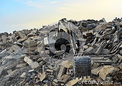 Recycling concrete and construction waste from demolition. Excavator at landfill of the disposa. Reuse of building rubble. Backhoe Editorial Stock Photo