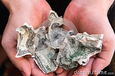 Recycling fake banknotes. Counterfeit banknotes wrinkled in hands Stock Photo