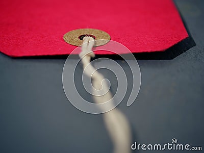 Red address label gift tag background close up macro shot Stock Photo