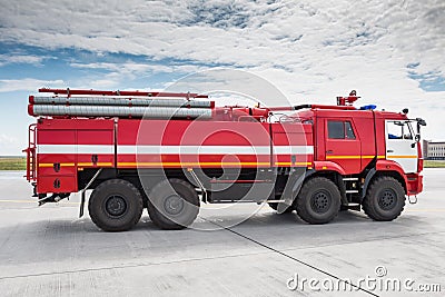 Red airfield firetruck at the airport Stock Photo