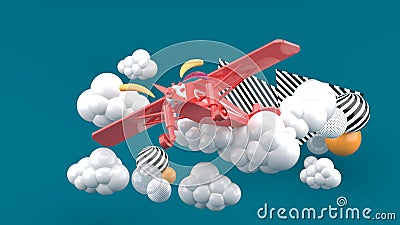 Red airplane in the clouds on a green background. Stock Photo