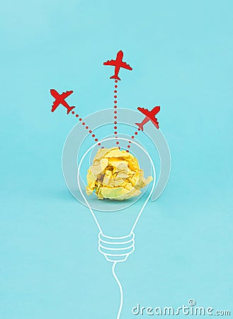 Red airplanes flying out of a crumpled yellow paper, brainstorming for ideas in a team, startup in business, having a goal Stock Photo