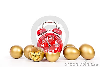 Red alarm clock,gold egg and gold coin Stock Photo