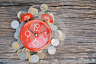 Red alarm clock on old wood background Stock Photo