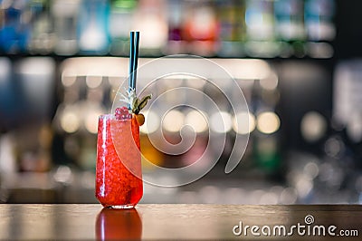 Red alcohol cocktail on the bar counter Stock Photo