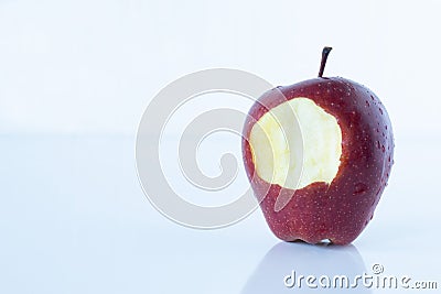 Red apple bitten isolated on white background with reflection Stock Photo