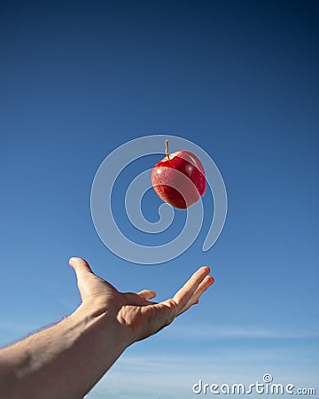 Red Apple Floating in the Air Stock Photo