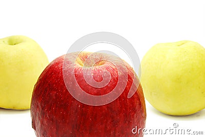 Red Apple in front of Yellow Stock Photo