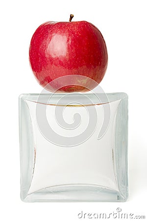 Red apple on glass cube Stock Photo