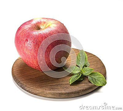 Red apple wet wood board green sheet isolated fruit Stock Photo