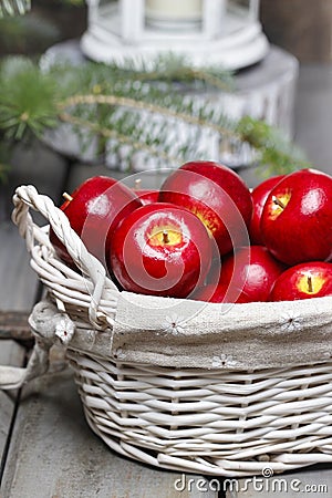 Red apples in basket. Traditional christmas setting. Stock Photo