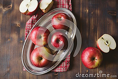 Red apples on plank wooden table Stock Photo