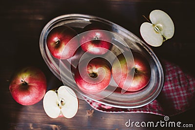 Red apples on plank wooden table Stock Photo