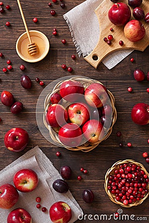 Red apples with plums and cranberries Stock Photo