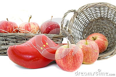 Red apples and wooden shoe Stock Photo