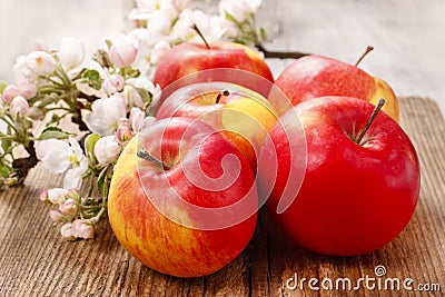 Red apples on wooden table Stock Photo
