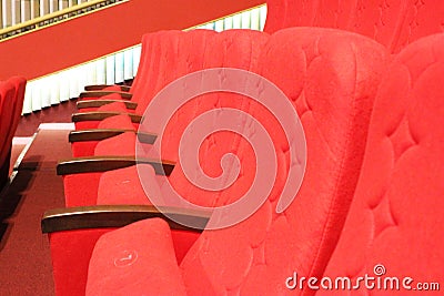 red armchairs. Empty concert hall, theater chairs background ... color photo, empty cinema or concert hall. The red Stock Photo