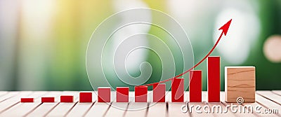 Red arrow pointing up over increasing bar graph showing growth Stock Photo
