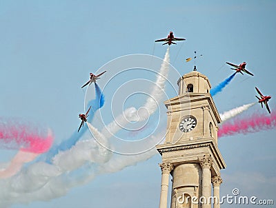 Red arrows over clock tower Editorial Stock Photo