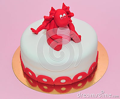 Red baby dragon birthday cake Stock Photo