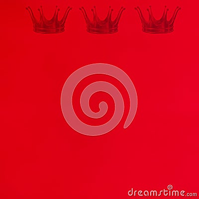 Red background with royal crowns Stock Photo