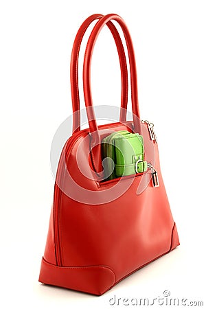 Red bag with green wallet Stock Photo
