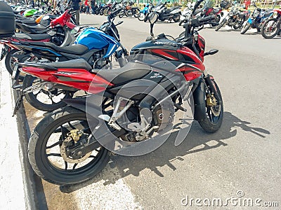 Red Bajaj Rouser Pulsar NS 200 Indian sport motorcycle. Expo Wheels 2021 motorbikes show. Editorial Stock Photo